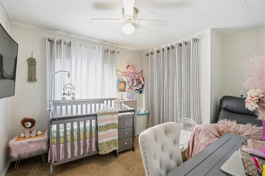 8055 Country Club Drive Brooksville, FL 34613 - Photo 26 of 33 a bedroom with a bed and a window