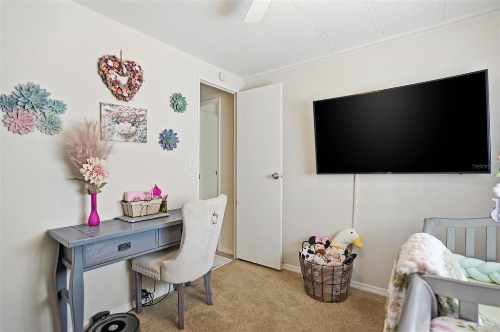 8055 Country Club Drive Brooksville, FL 34613 - Photo 27 of 33 a living room with furniture and a flat screen tv