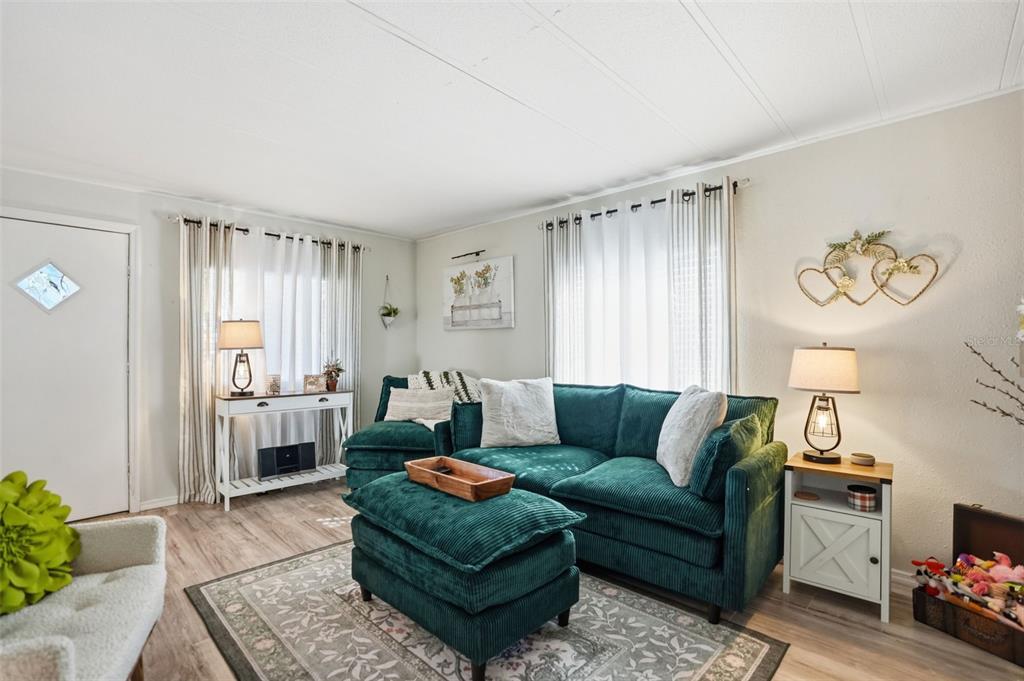 8055 Country Club Drive Brooksville, FL 34613 - Photo 6 of 33 a living room with furniture and a window
