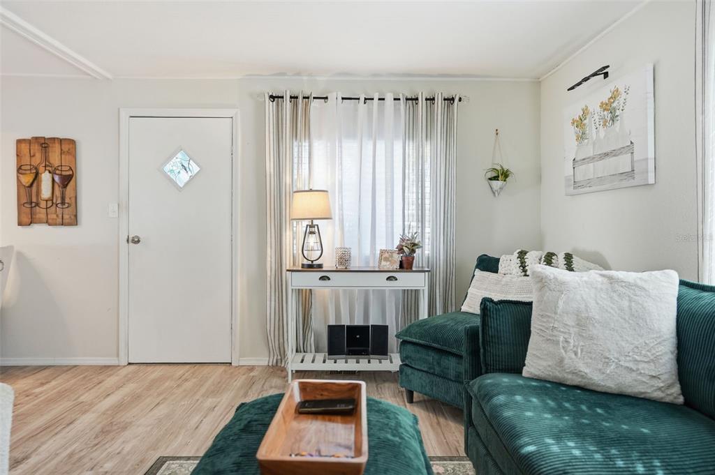 8055 Country Club Drive Brooksville, FL 34613 - Photo 8 of 33 a living room with furniture and a window