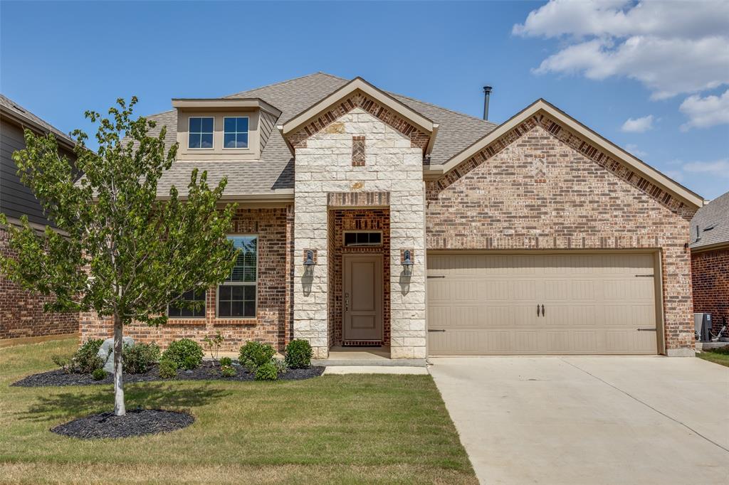 3816 Blacksmith Road Aubrey, TX 76227 - Photo 1 of 30 Brick and stone facade with a dormer window