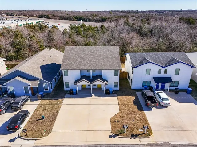 an aerial view of a house with swimming pool