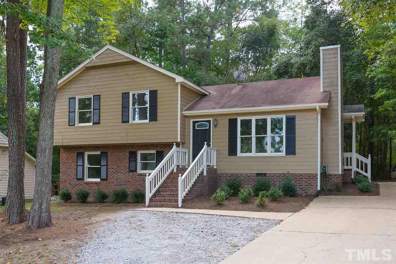 4216 Labrador Drive Raleigh, NC 27616 - Photo 1 of 20 a front view of a house with a yard and garage