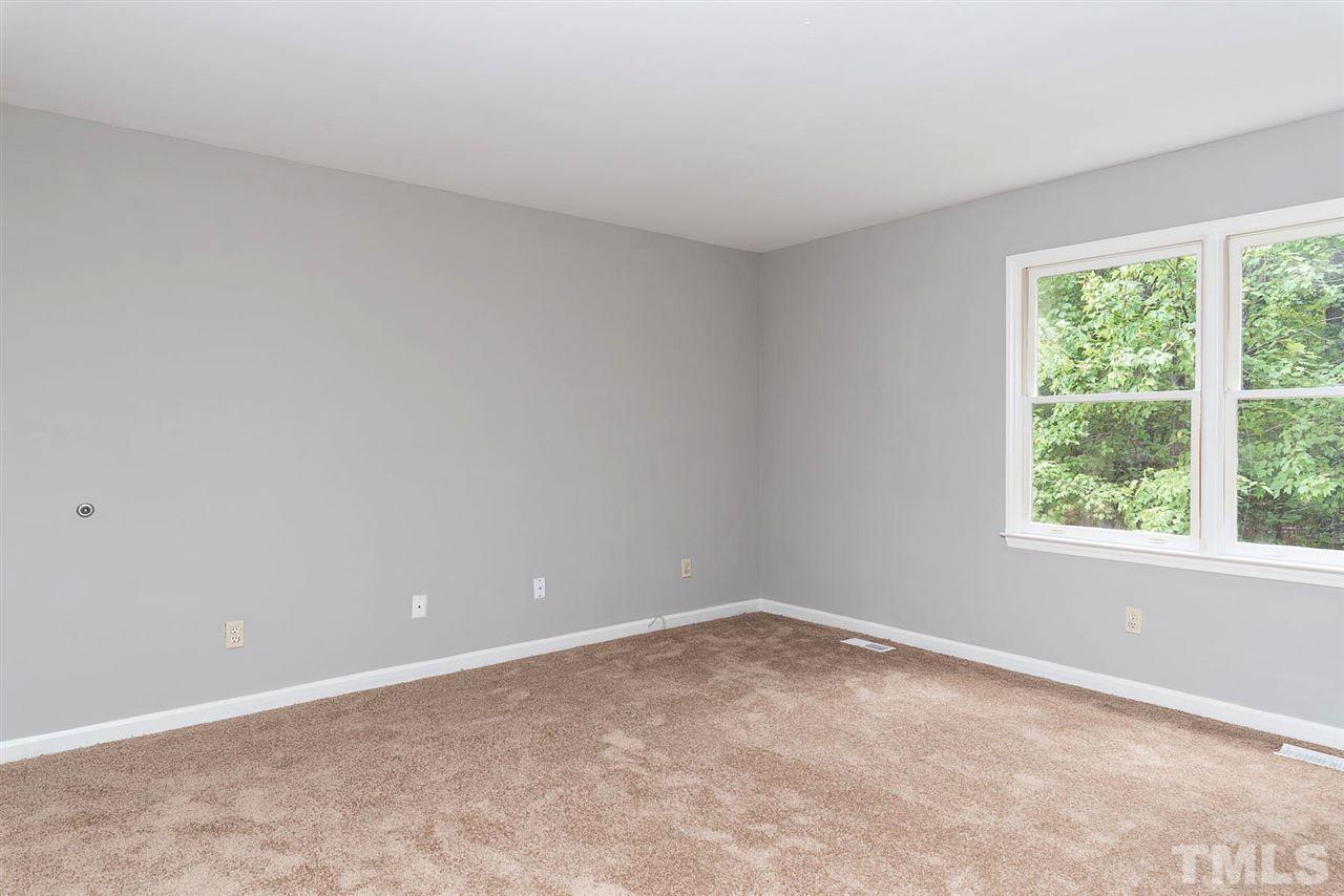 4216 Labrador Drive Raleigh, NC 27616 - Photo 11 of 20 an empty room with a window