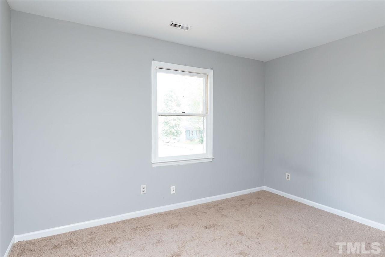 4216 Labrador Drive Raleigh, NC 27616 - Photo 17 of 20 an empty room with a window