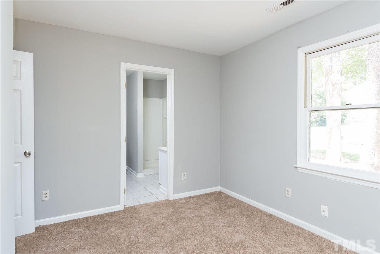 4216 Labrador Drive Raleigh, NC 27616 - Photo 18 of 20 an empty room with windows and closet