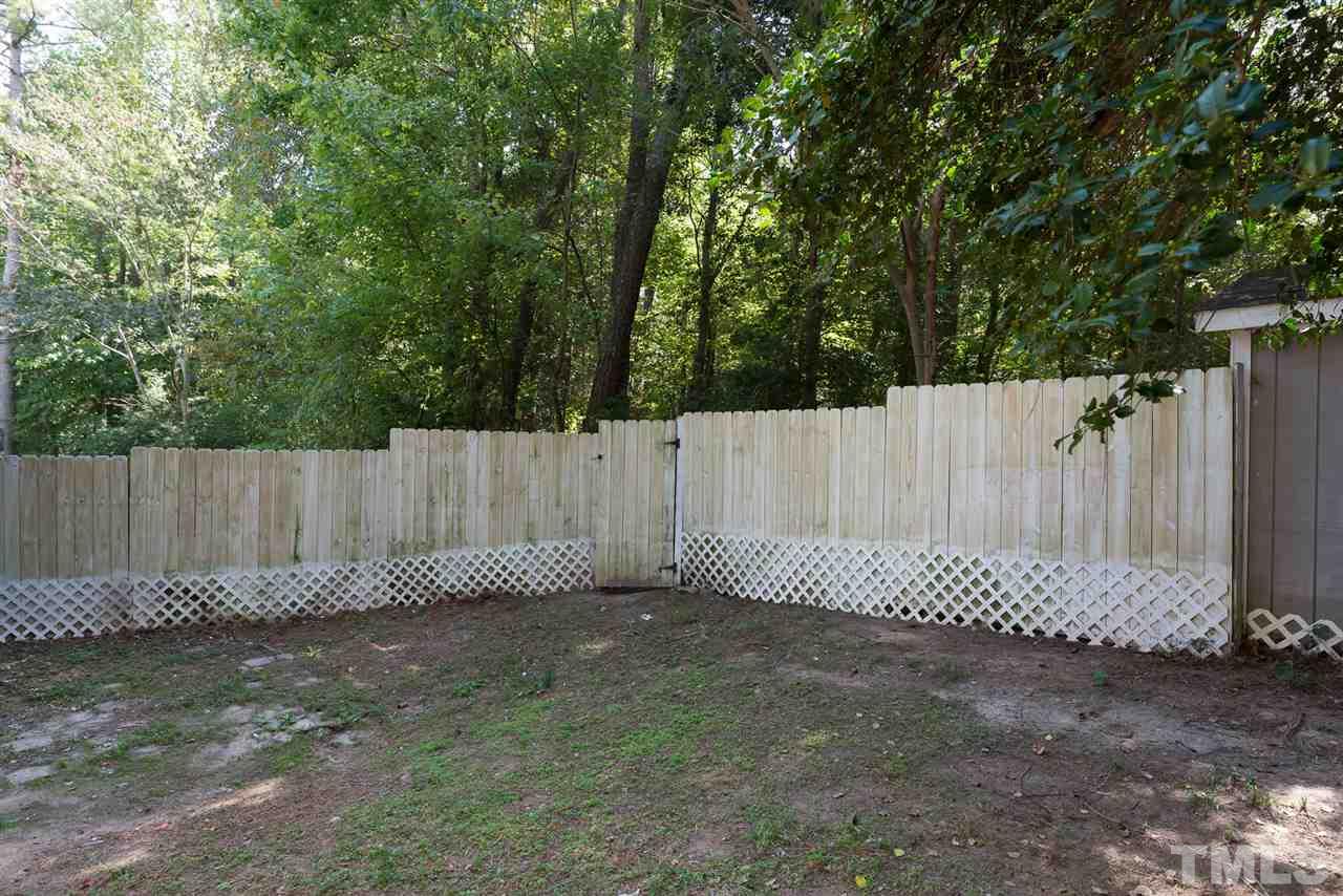 4216 Labrador Drive Raleigh, NC 27616 - Photo 20 of 20 a garden area with wooden fence