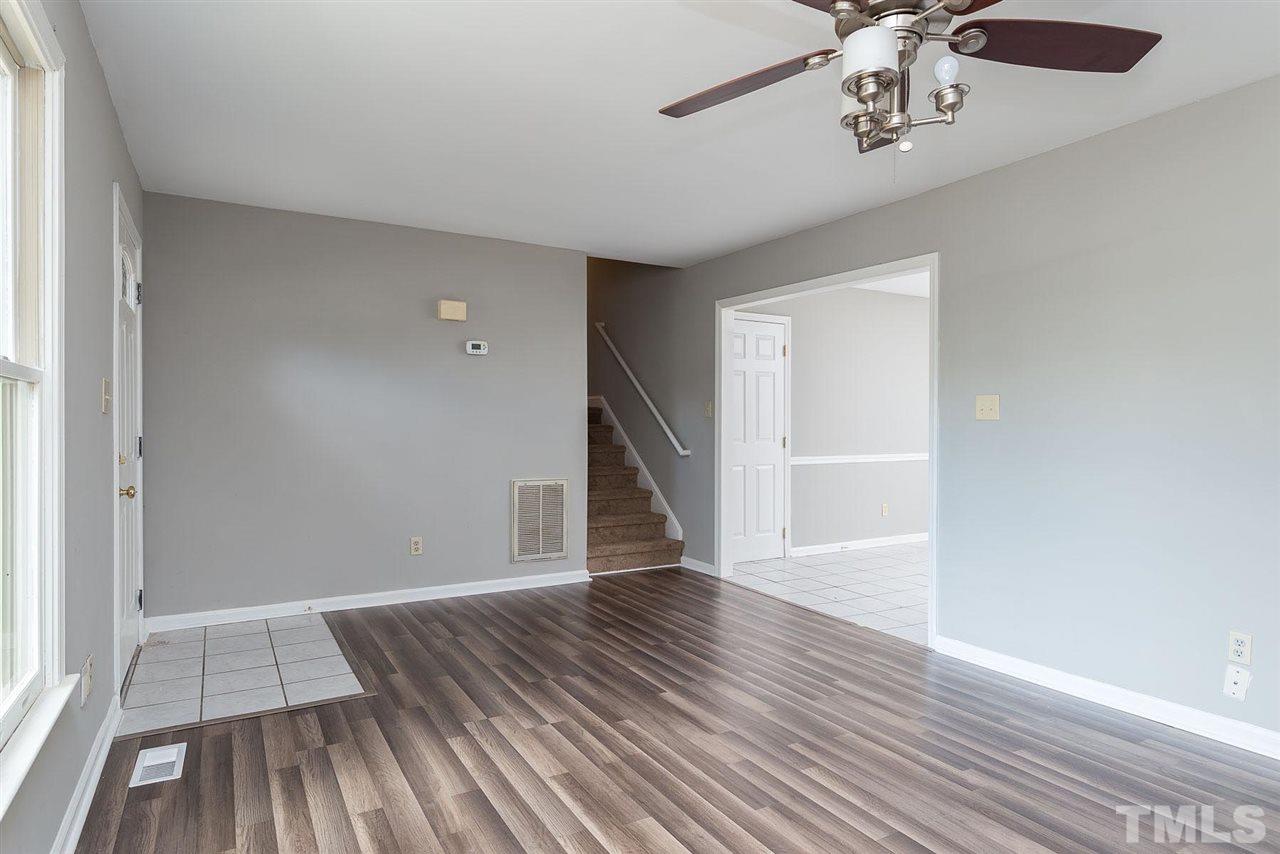 4216 Labrador Drive Raleigh, NC 27616 - Photo 4 of 20 wooden floor in an empty room with a window