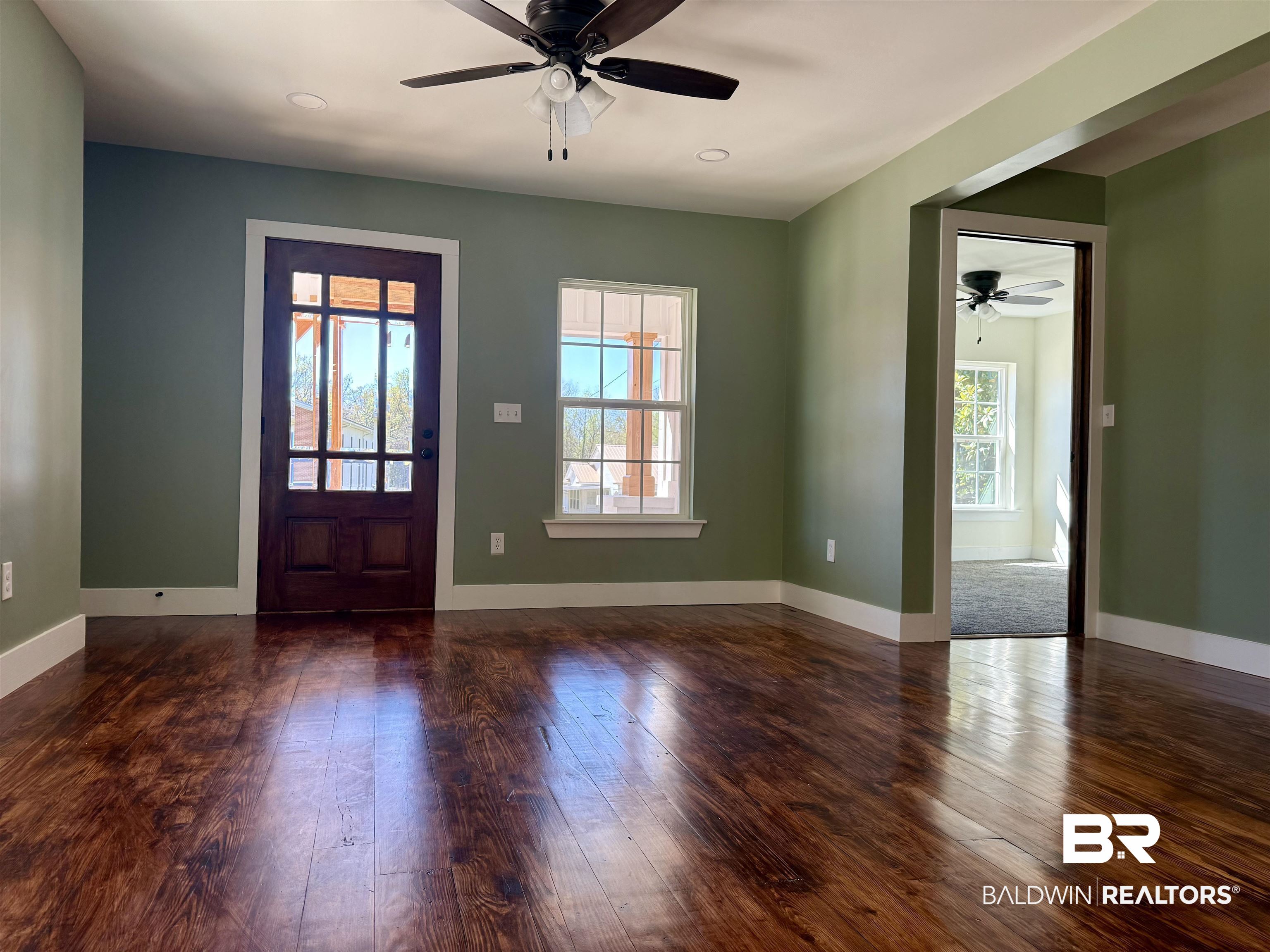 613 Forrest Avenue Brewton, AL 36426 - Photo 5 of 22 Foyer featuring ceiling fan and dark wood-style flooring