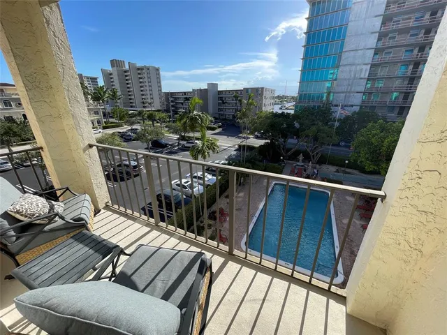 a view of balcony with furniture