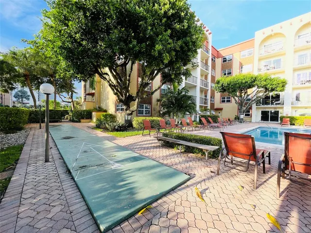 a view of a backyard with sitting area