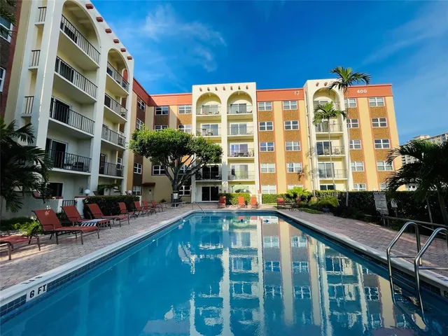 a view of a swimming pool with a lounge chair