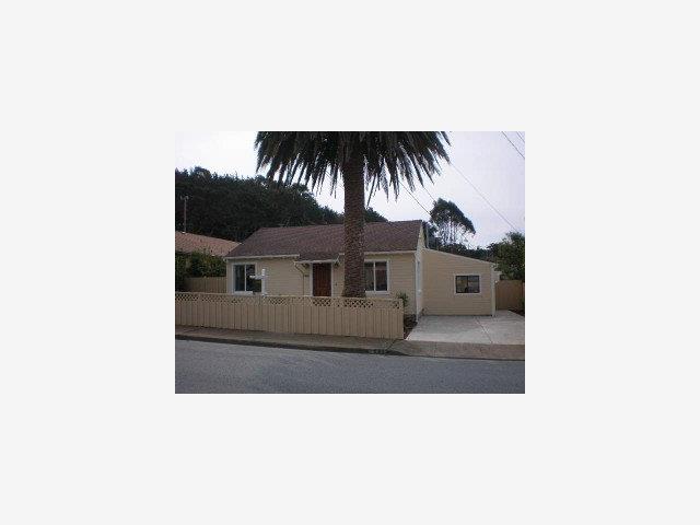 a picture of a living room with a couch
