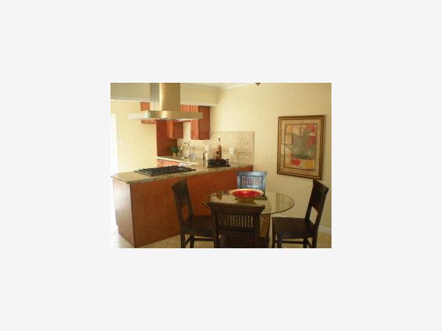 280 Brighton Road Pacifica, CA 94044 - Photo 3 of 9 a living room with a couch and a table