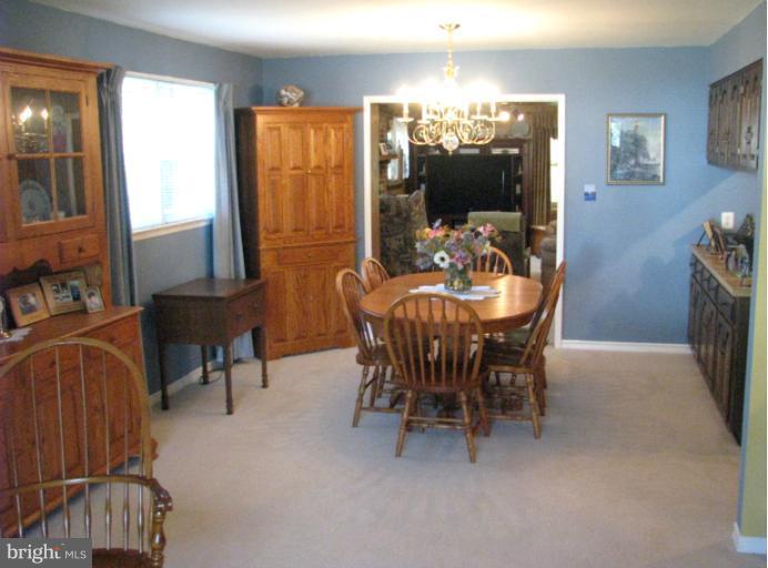 7425 Elgar Street Springfield, VA 22151 - Photo 14 of 28 a dining room with furniture and window