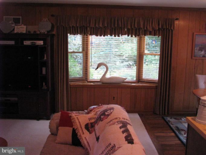 7425 Elgar Street Springfield, VA 22151 - Photo 3 of 28 a bed sitting in a bedroom next to a window