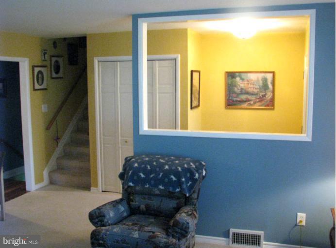 7425 Elgar Street Springfield, VA 22151 - Photo 8 of 28 a living room with furniture and a large window