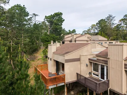 an aerial view of a house with outdoor space