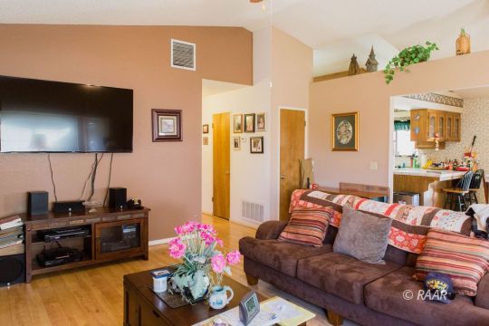 204 North Broadway Street Ridgecrest, CA 93555 - Photo 8 of 29 a living room with furniture and a flat screen tv