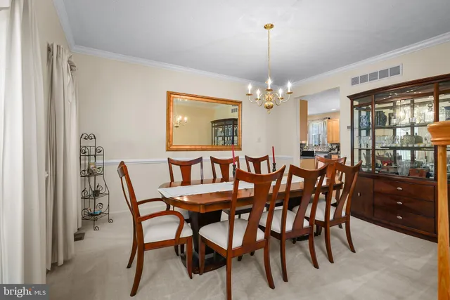 a view of a dining room with furniture and window