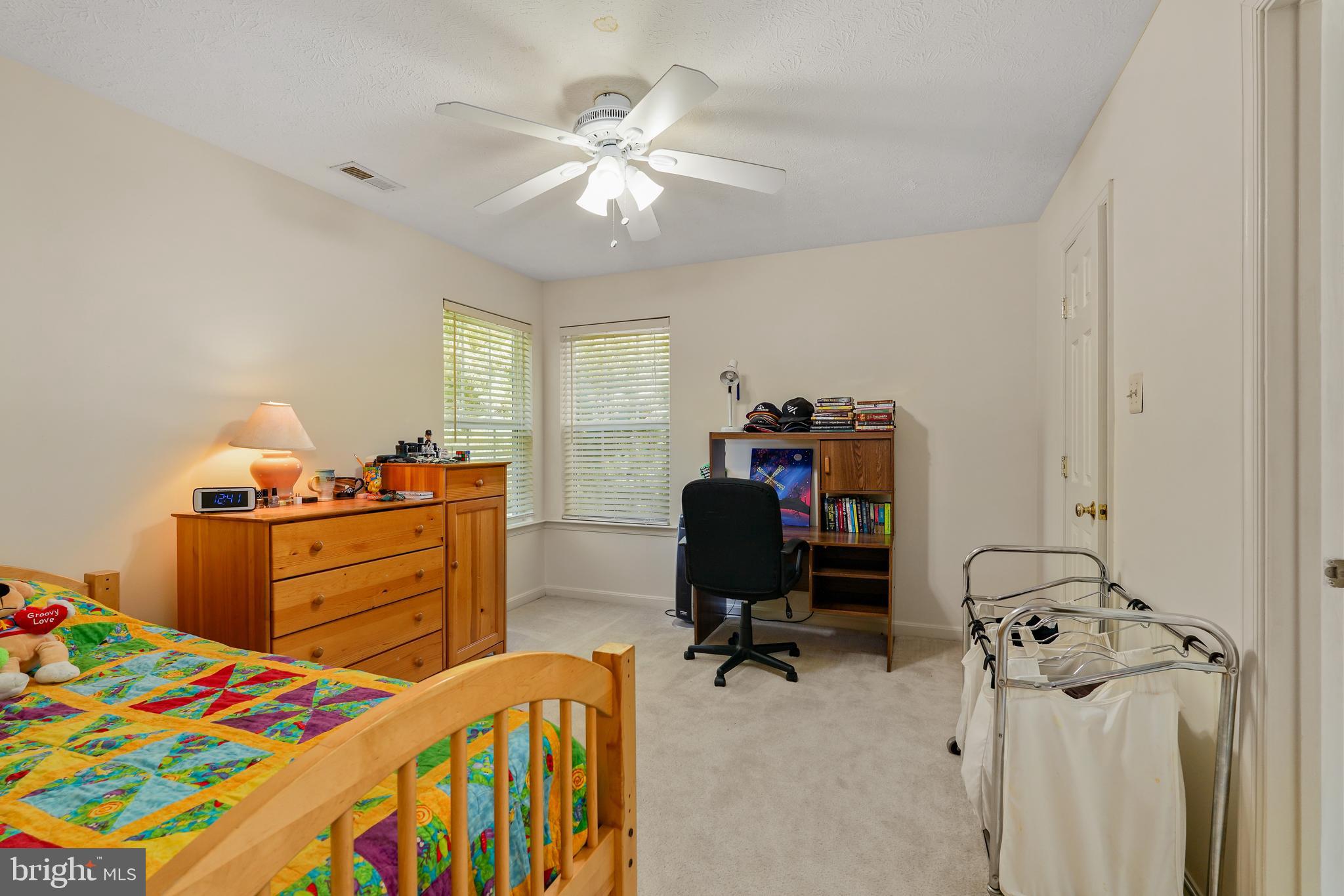 41 Austins Way Elkton, MD 21921 - Photo 27 of 47 a bedroom with a baby bed and a chandelier