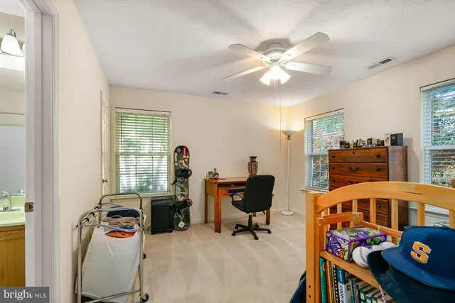 a bedroom with furniture and a window