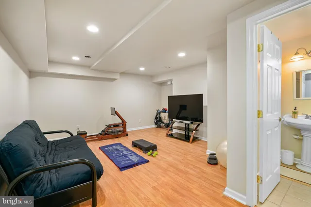a bedroom with furniture and a flat screen tv