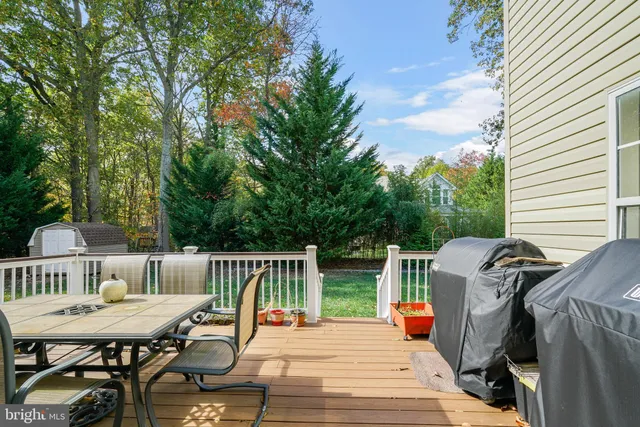 a view of a patio with a table and chairs