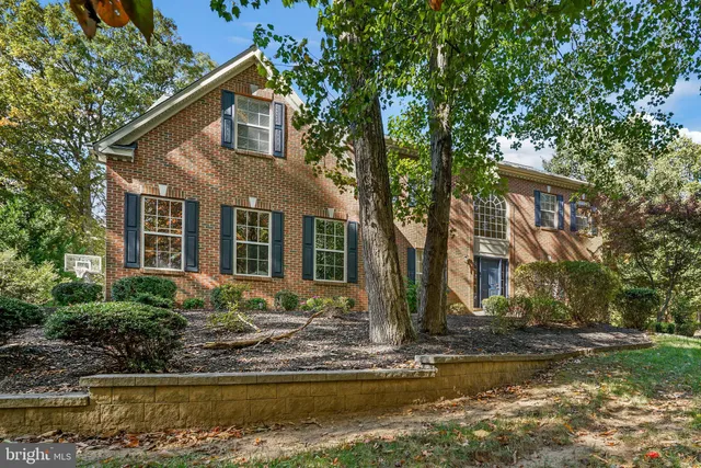 a front view of a house with a yard garage and outdoor seating