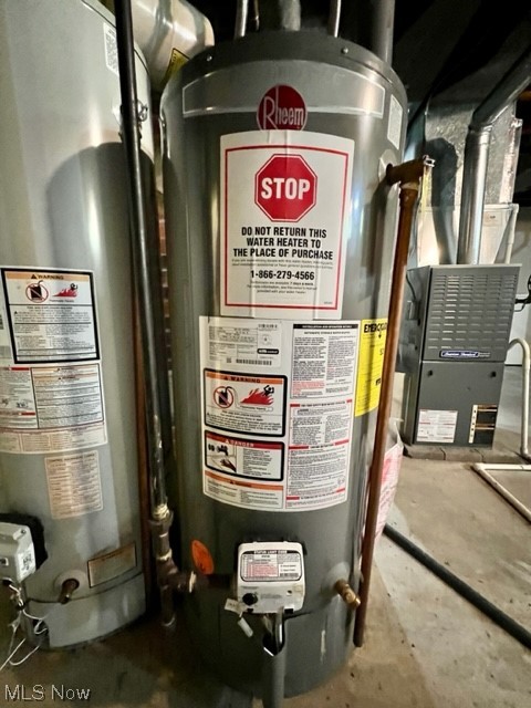 2480 Noble Road Cleveland, OH 44121 - Photo 25 of 31 Utility room featuring gas water heater