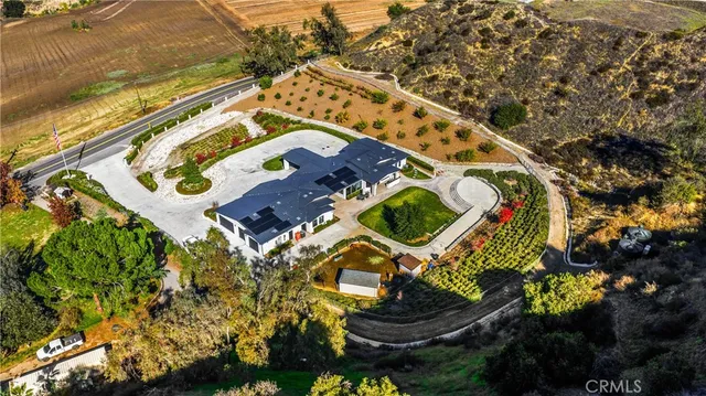 an aerial view of a house with a lake view