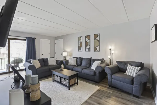 a living room with furniture and a large window