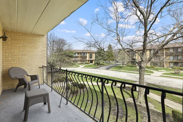 a view of a chairs and tables in the balcony