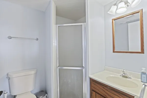 a bathroom with a sink toilet and vanity