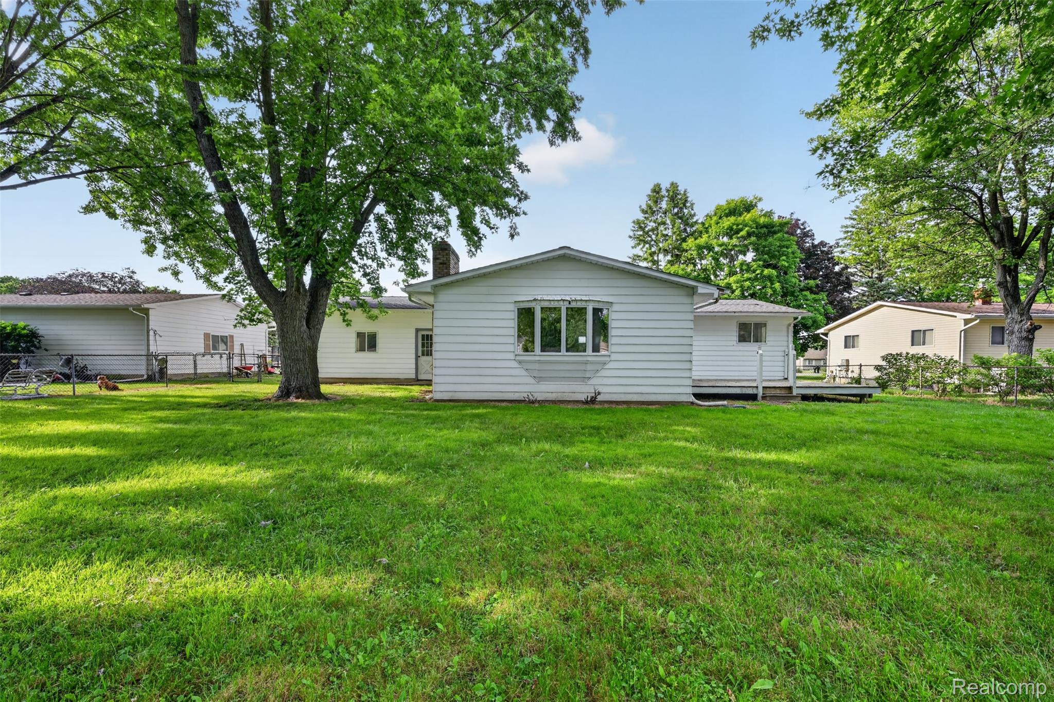 5457 Reid Road Swartz Creek, MI 48473 - Photo 43 of 51 Expansive green lawn providing ample outdoor space