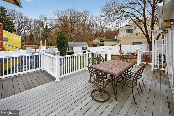 a front view of a house with a yard fire pit and outdoor seating