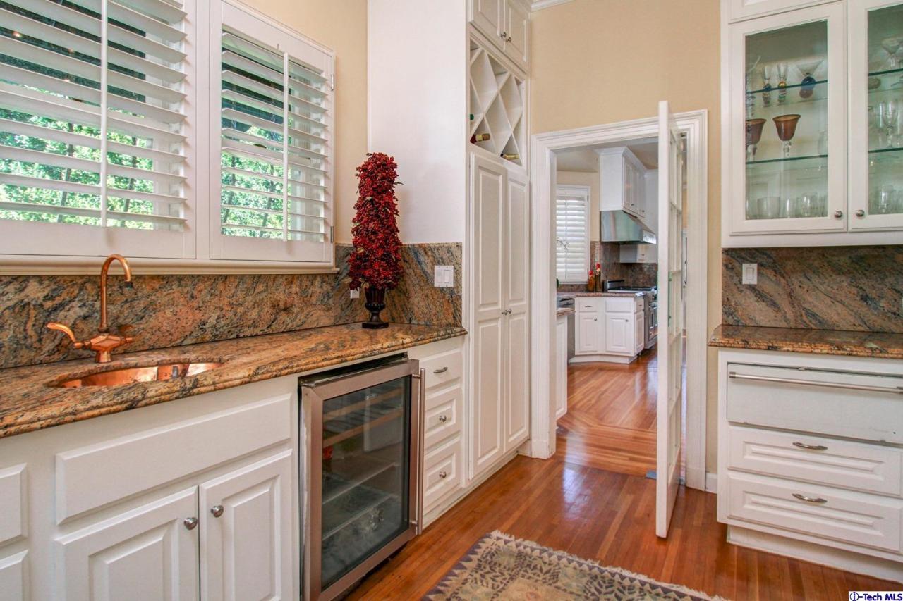 1680 Lombardy Road Pasadena, CA 91106 - Photo 16 of 71 a kitchen with a stove a sink and a refrigerator