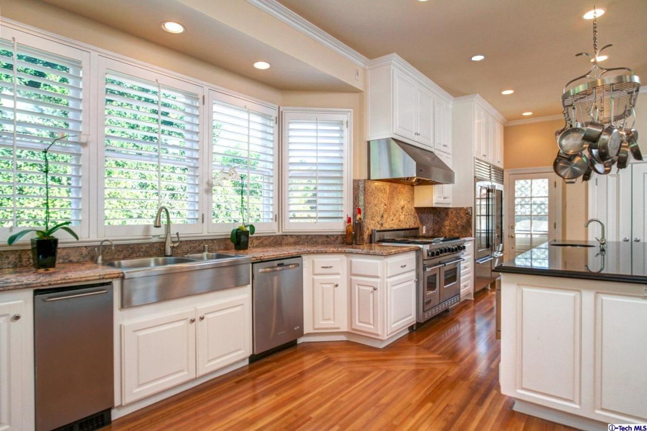 1680 Lombardy Road Pasadena, CA 91106 - Photo 18 of 71 a kitchen with stainless steel appliances granite countertop a stove a sink and a refrigerator
