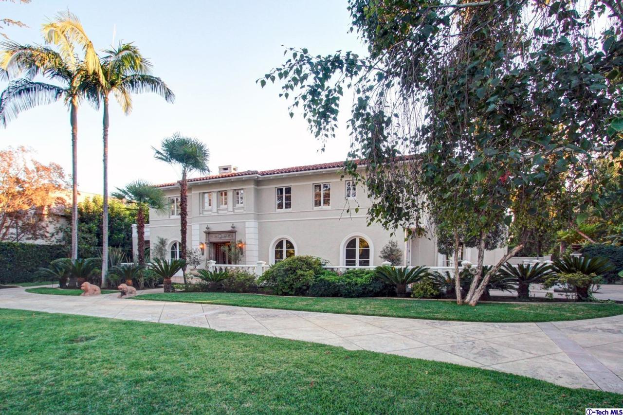 1680 Lombardy Road Pasadena, CA 91106 - Photo 3 of 71 a view of a white house with a big yard and palm trees