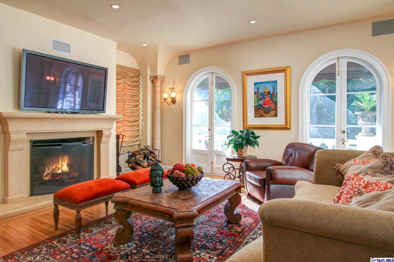 1680 Lombardy Road Pasadena, CA 91106 - Photo 23 of 71 a living room with furniture fireplace and a large window