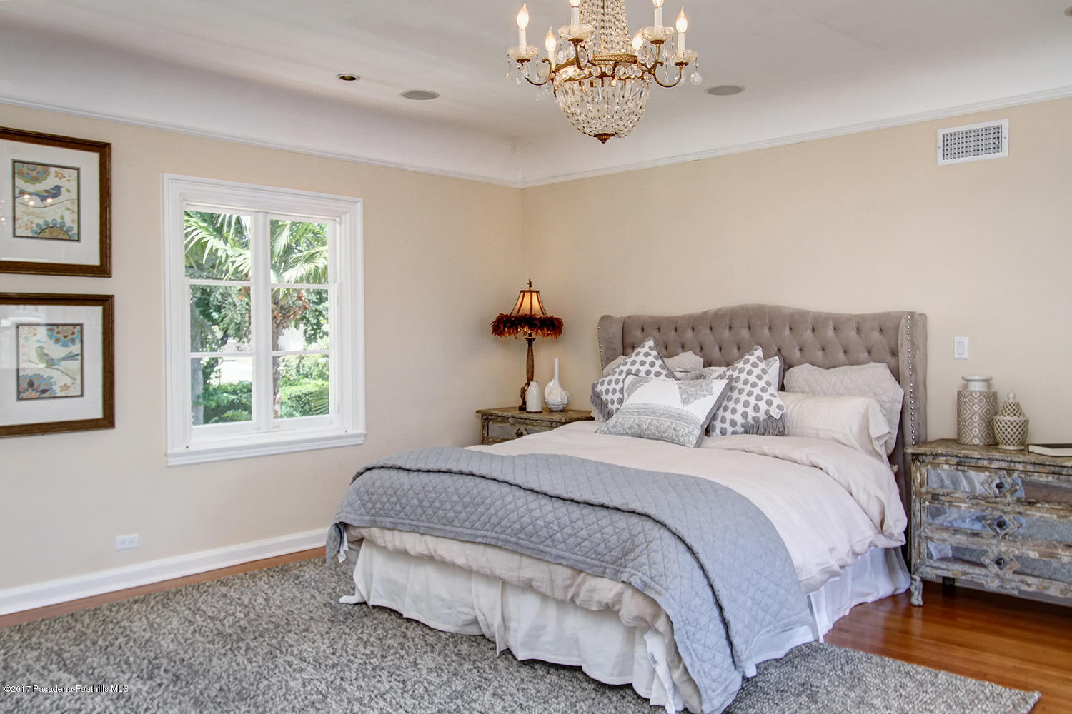 1680 Lombardy Road Pasadena, CA 91106 - Photo 32 of 71 a bedroom with a large bed and a chandelier