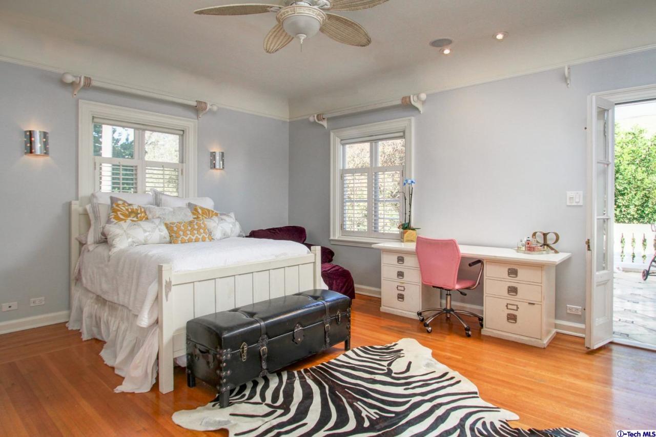 1680 Lombardy Road Pasadena, CA 91106 - Photo 37 of 71 a bedroom with a bed and wooden floor