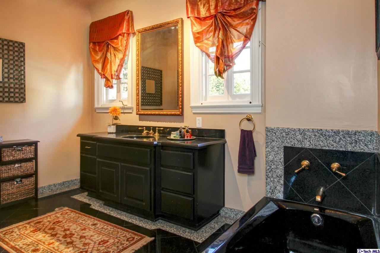 1680 Lombardy Road Pasadena, CA 91106 - Photo 40 of 71 a room with a fireplace and a window