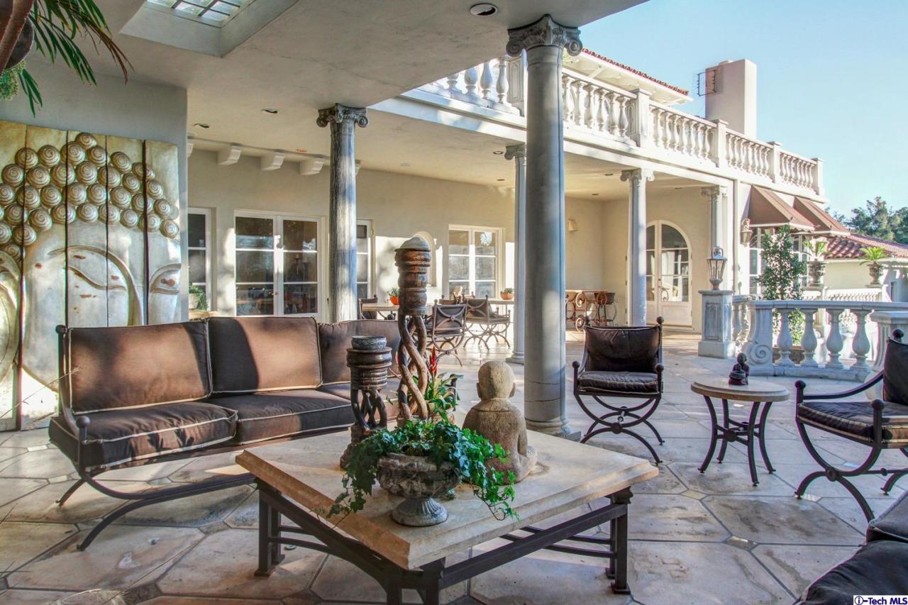 1680 Lombardy Road Pasadena, CA 91106 - Photo 48 of 71 a living room with furniture a flat screen tv and a floor to ceiling window