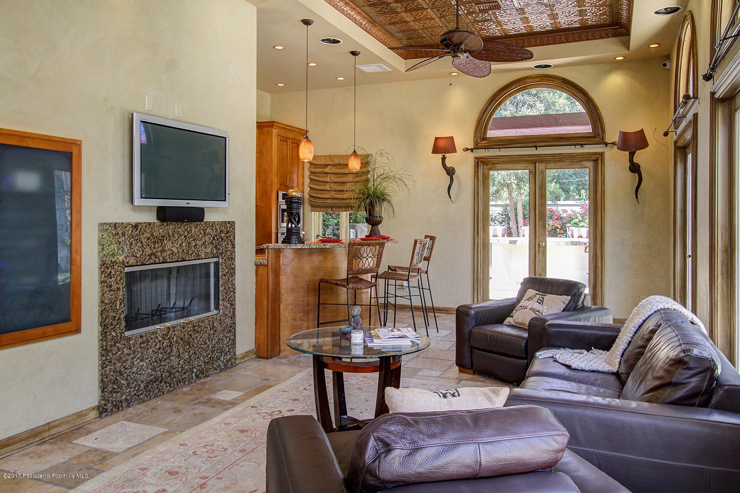 1680 Lombardy Road Pasadena, CA 91106 - Photo 52 of 71 a living room with furniture a fireplace and a flat screen tv