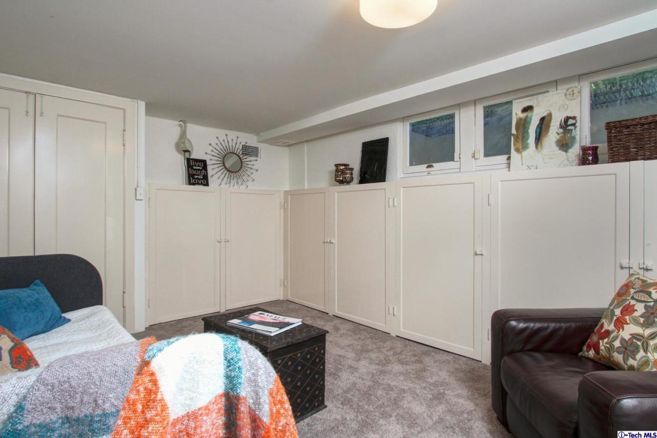 1680 Lombardy Road Pasadena, CA 91106 - Photo 59 of 71 a bedroom with a bed and a couch