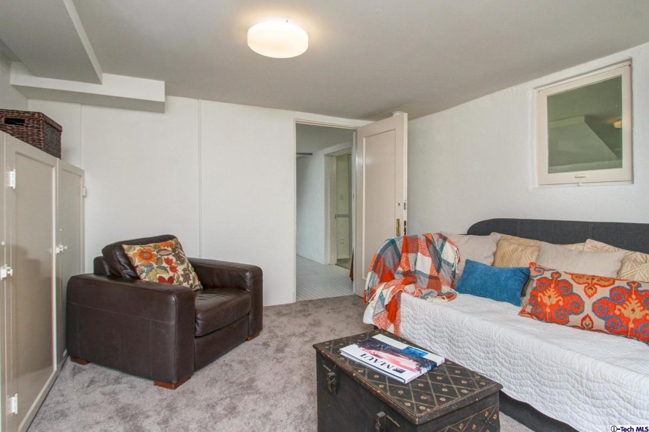 1680 Lombardy Road Pasadena, CA 91106 - Photo 60 of 71 a living room with furniture and a couch