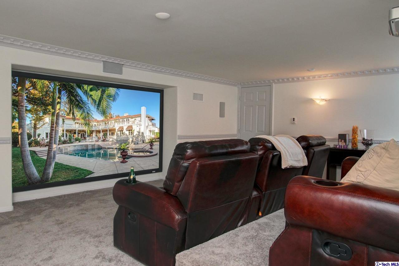 1680 Lombardy Road Pasadena, CA 91106 - Photo 62 of 71 a living room with furniture fireplace and a floor to ceiling window