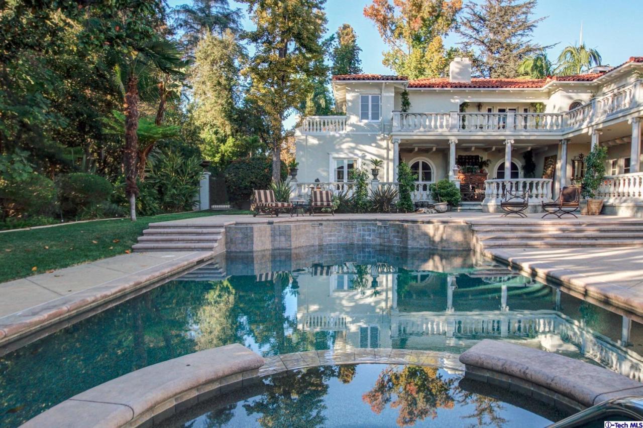1680 Lombardy Road Pasadena, CA 91106 - Photo 69 of 71 a view of a patio with table and chairs potted plants and large tree