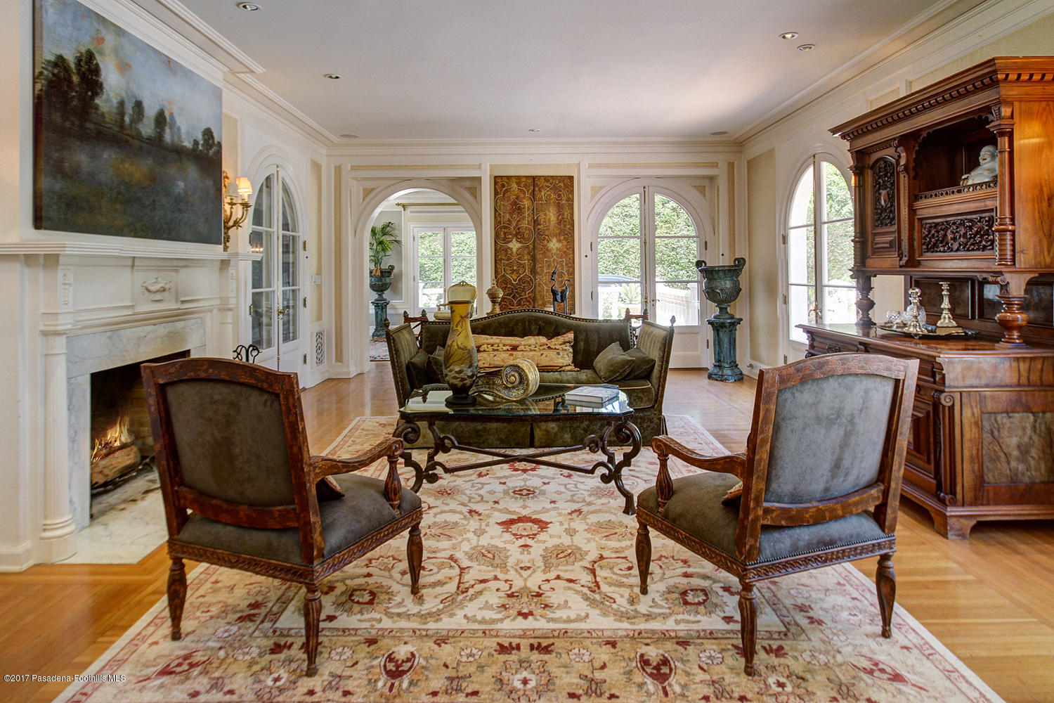 1680 Lombardy Road Pasadena, CA 91106 - Photo 10 of 71 a living room with furniture a flat screen tv and a fireplace